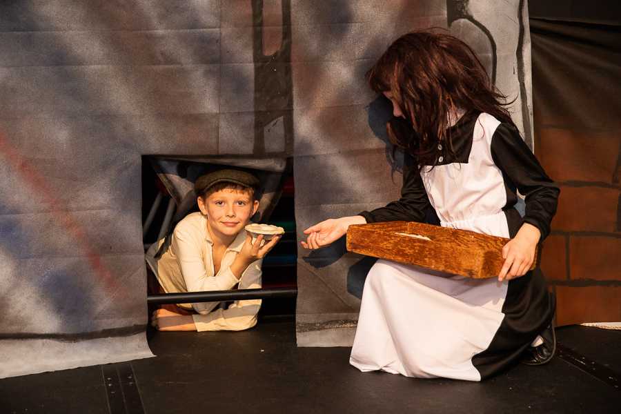 a boy acting on stage