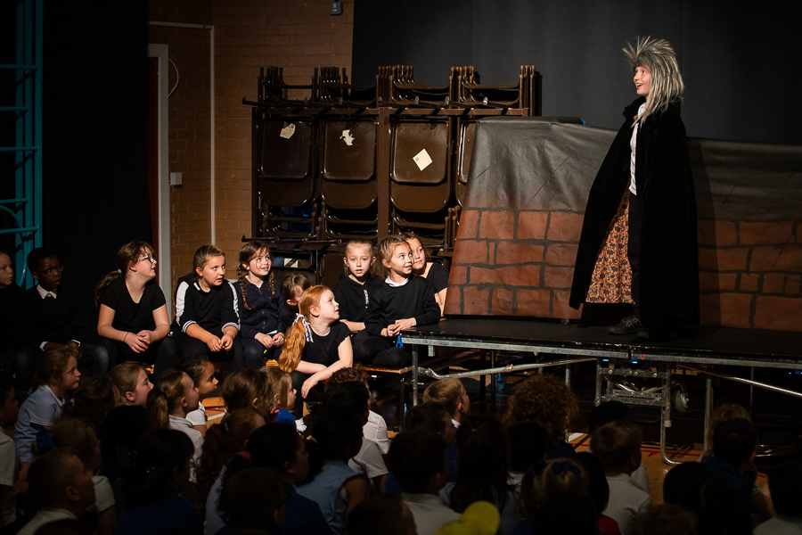 school children enjoying a performance