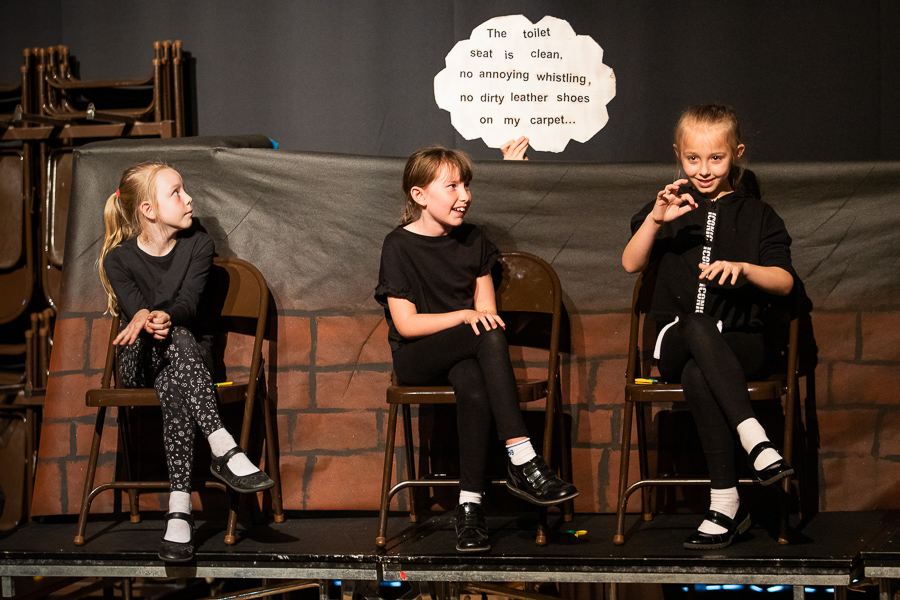 children performing on stage