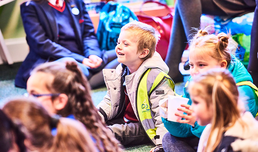 a group of children having fun in a workshop